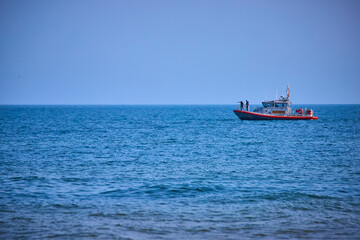 Fototapeta premium Coast Guard Patrol Boat on Calm Lake Michigan from Low Vantage Point