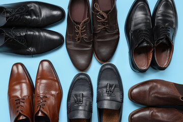 Man's shoes on blue background. Top view