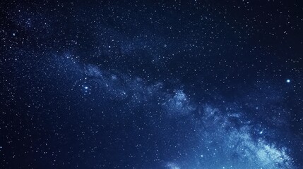 Naklejka premium A stunning view of the night sky filled with stars and the Milky Way galaxy.