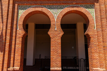 Las Ventas bullring, Madrid, Bull square. Plaza de toros. Events and traditions of Spain. Red sand under a burning sun. No people. Fight between matador and bull. Blood, passion, dance, celebration.