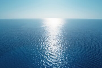 Obraz premium A calm lake with a small boat visible in the distance, perfect for use in travel or outdoor themed projects