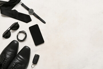 Set of male accessories with tie, sunglasses and mobile phone on white background. Top view