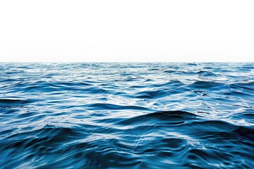 Naklejka premium A serene lakeside scene with a small boat visible in the distance, surrounded by lush greenery and calm waters