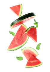 Flying pieces of fresh watermelon and mint on white background