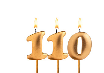 Golden candle number 110 - Birthday on white background