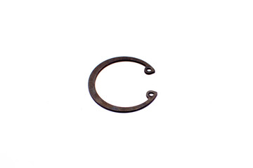 Black circlip retaining rings scattered on a white background.