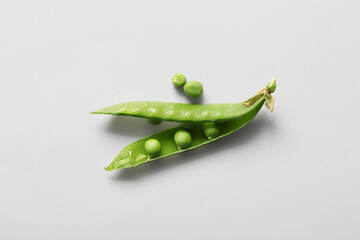 Green peas on light background