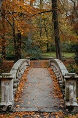 A stone bridge in a park, surrounded by greenery