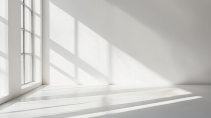 A bright white room illuminated by sunlight streaming through a large window, creating a warm and inviting atmosphere.