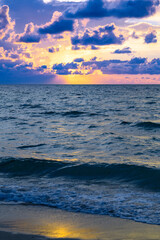 Obraz premium Colorful dramatic sky. Big cloud above ocean. Cloud sky with sea background. Amazing dramatic sky sunset background.
