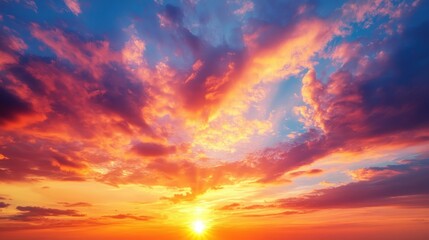 Obraz premium A vibrant sunset with colorful clouds illuminating the sky.