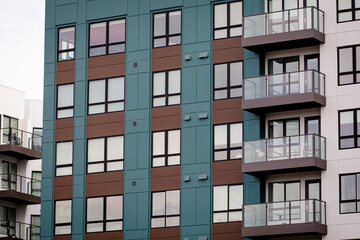 Exterior view of modern apartment building. New construction apartment or condo complex. Modern new residential apartment house building complex