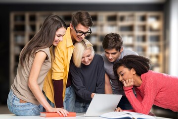 Happy students friends learning in library for education