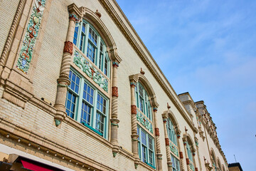 Ornate Historical Facade with Arched Windows from Low Angle