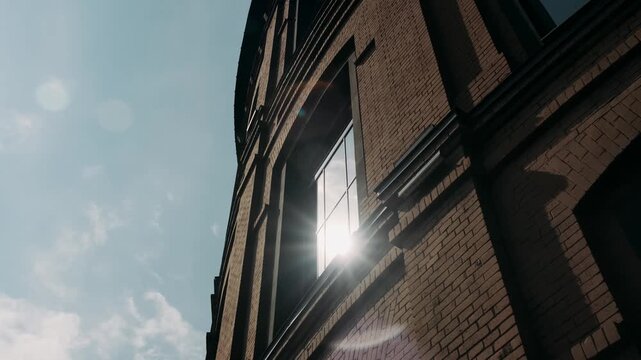 brick facade of a building against a clear sky