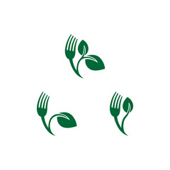 cutlery and green leaf vector illustration for an icon,symbol or logo. vegan food logo