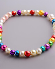 Obraz premium rainbow pearl bracelet, colorful pearl bracelet, pearl jewelry, rainbow bracelet, multicolored pearls, pearl bracelet design, vibrant pearl bracelet, colorful jewelry, rainbow-colored bracelet, pearl 