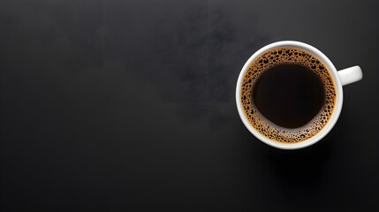 A coffee cup with dark brew, centered on a black background, minimalist composition, extensive copy space, studio lighting emphasizing contrast.