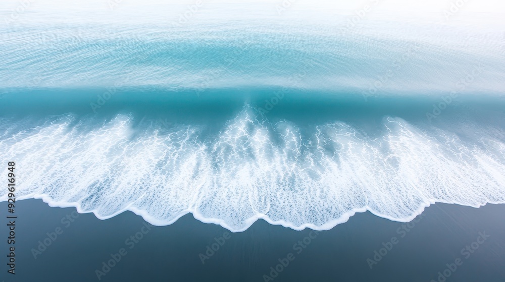 Wall mural a large wave crashing onto a beach