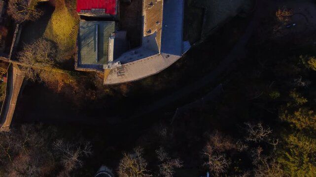 Drone footage of Eppstein Castle and medieval old town in Germany at sunrise. The serene morning light highlights historic architecture of castle and medieval town of Europe. Shots: Top Down