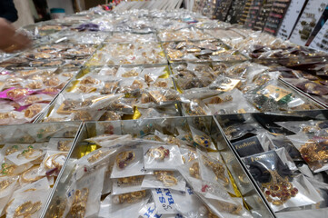 Gold and silver plated ornaments, bangles, jewelry are being sold at famous Sardar Market and Ghanta ghar Clock tower in afternoon. Blue hour.