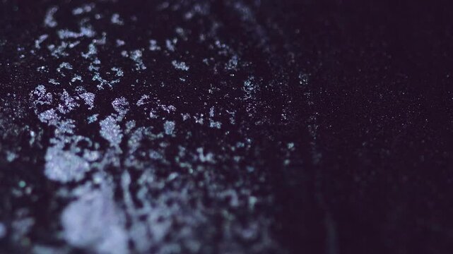 Glitter ink mix. Shimmer liquid drip. Blur black silver color metallic shiny sand particles texture pigment acrylic fluid paint spill motion abstract art background.