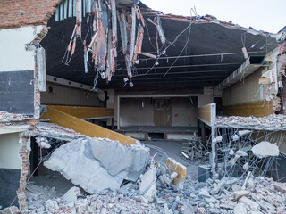 The destruction of an indoor space, following a powerful earthquake, showcases debris and the...