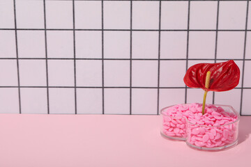 Wax granules for depilation with a red flower