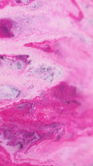 Fototapeta premium Glowing paint. Ink flow. Shiny glitter. Defocused pink white color shimmer liquid spill glamour cosmetic fluid sparkling particles motion abstract art background.