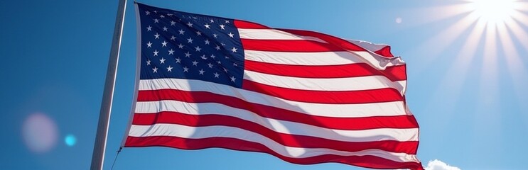 American flag waving against a clear blue sky, symbolizing patriotism, pride, seasonal relevance for July 4th, copy space for texts.