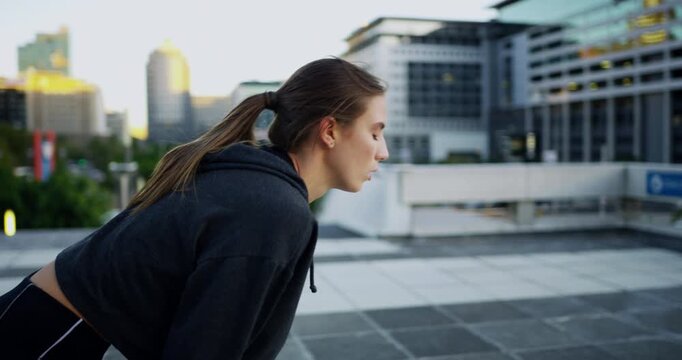 Fitness, running and thinking with woman in city for health, energy and cardio training. Wellness, challenge and tired with female runner and smart watch for exercise, workout and endurance