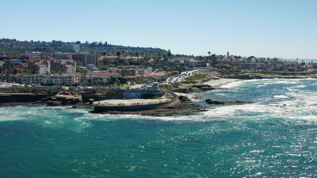 Circling a La Jolla Cove as Tourists Watch the Waves Crash