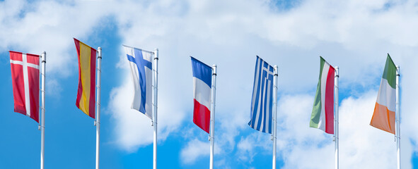 EU national flags flutter in wind, government Buildings, Space Agency, Parliament, Council Europe,...