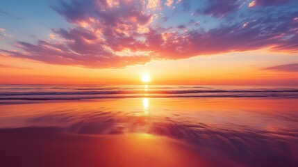 Obraz premium A serene sunset over the ocean, reflecting vibrant colors on the water's surface.