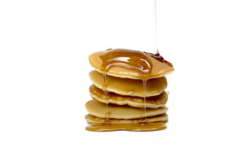 A stack of pancakes with syrup on top