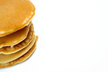 A stack of pancakes on a white background