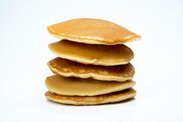 A stack of pancakes on a white background