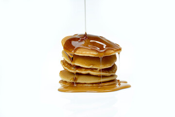 A stack of pancakes with syrup on top