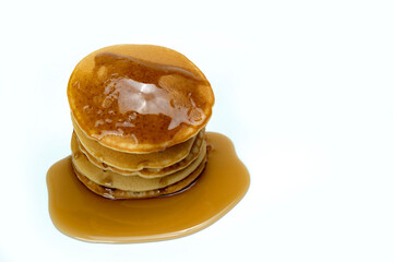 A stack of pancakes with syrup on top