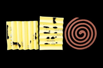 A yellow piece of paper with a mosquito coils on it