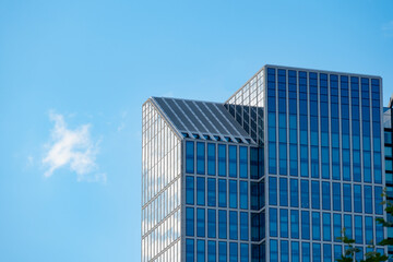 fragments office and residential buildings in European city with reflective glass facades, modern high-rise office buildings and residential towers