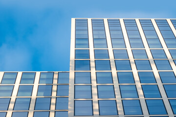 Obraz premium fragments office and residential buildings in European city with reflective glass facades, modern high-rise office buildings and residential towers