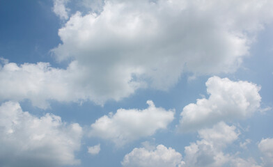
Blue sky with puffy clouds