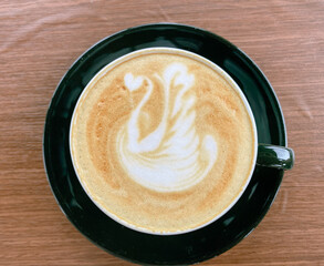 Cup of coffee on wooden table