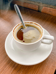Cup of coffee on wooden table