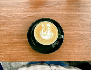 Cup of coffee on wooden table