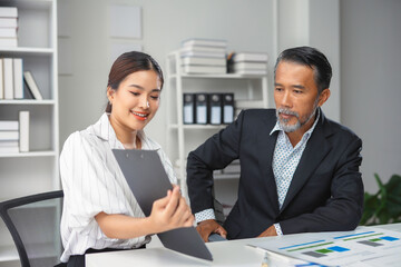 Two business people are discussing business ideas during a meeting in a modern office
