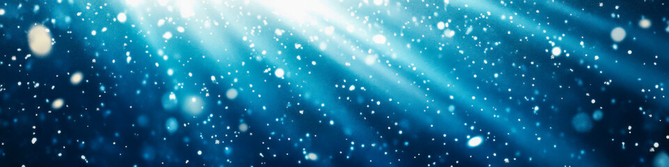 Naklejka premium Underwater light rays illuminate sparkling particles in a serene aquatic environment