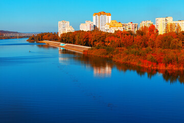 City with a river running through it and a bridge in autumn. Rybnitsa is a town in the breakaway Moldovan region of Transnistria