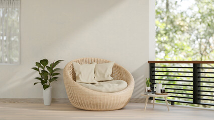 A contemporary home balcony relaxation space features a wicker lounge chair with pillows.